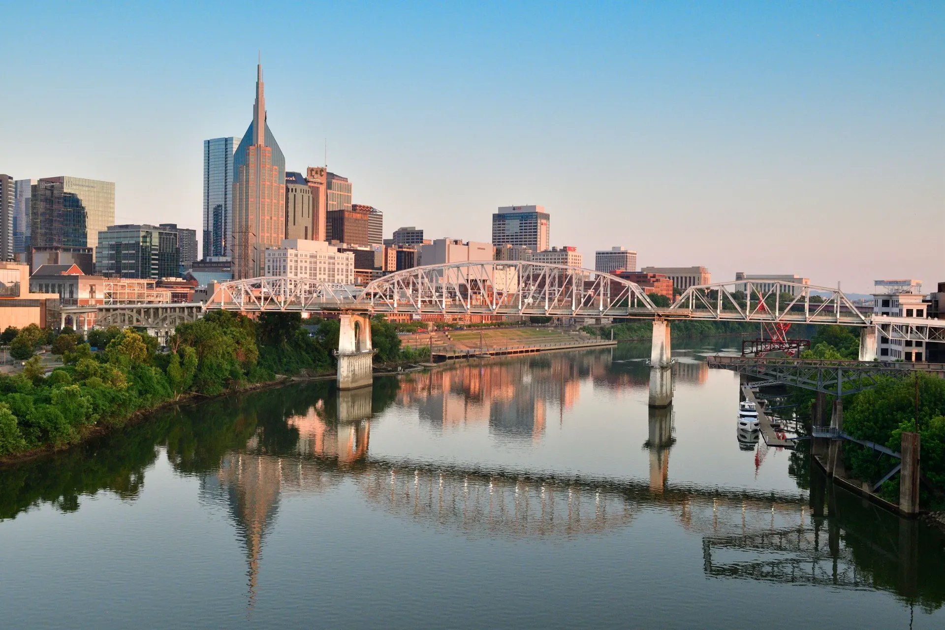 Nashville skyline over the Cumberland River with the John Seigenthaler Pedestrian Bridge
