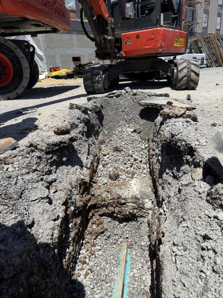 Excavation along the building at Echo Suites in Smyrna