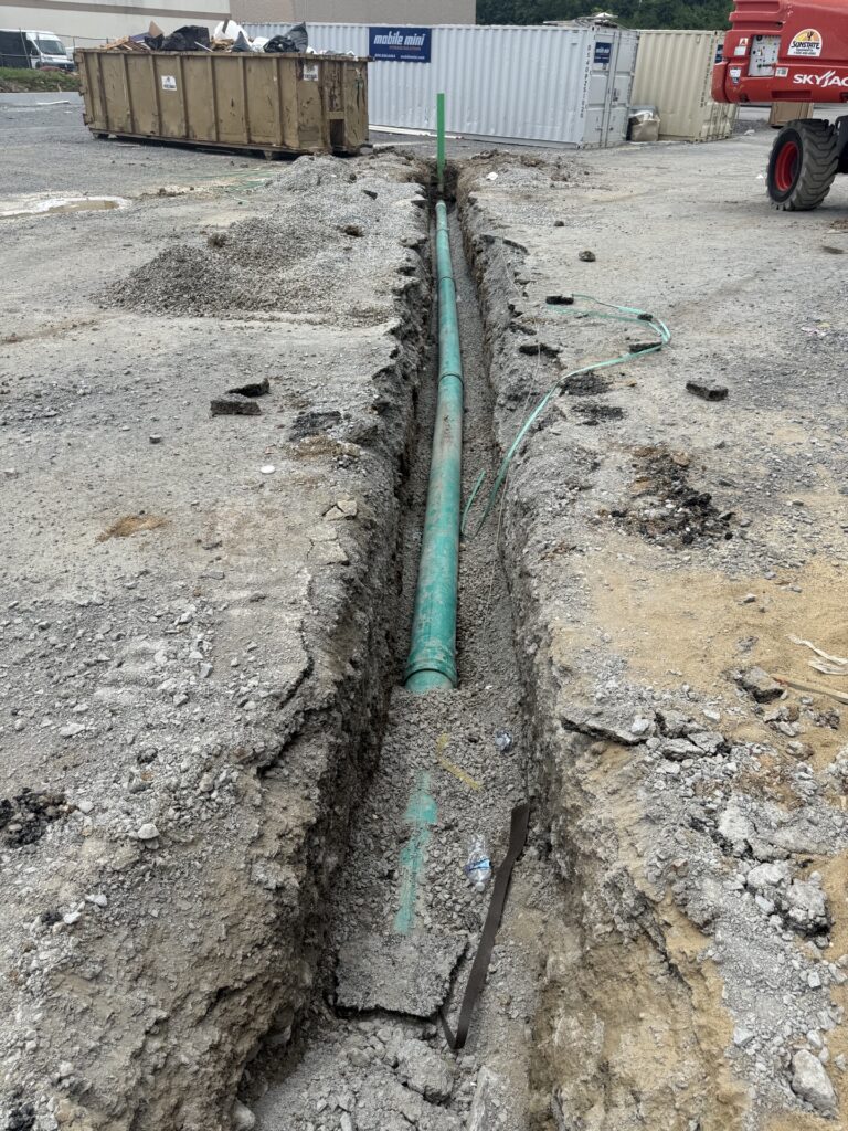 Sewer line trench running across the Echo Suites site