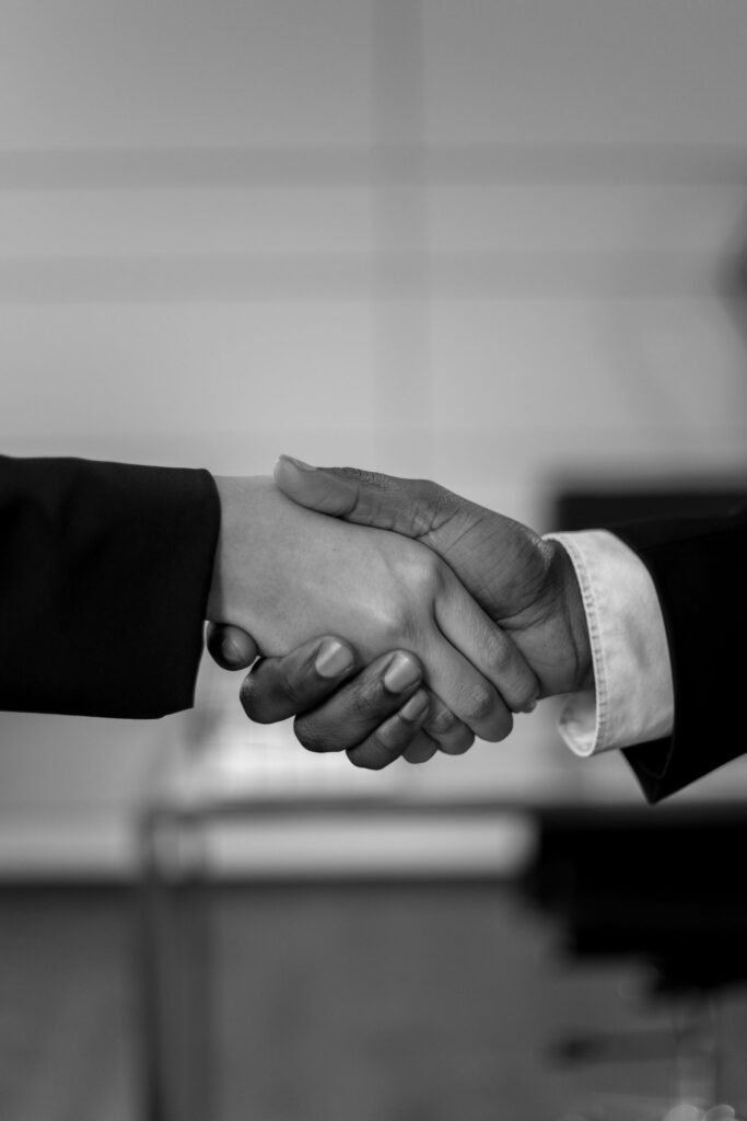 Black and white close-up of two hands shaking