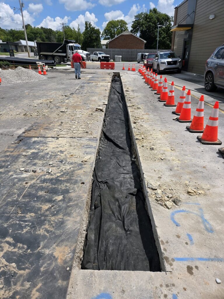 Utility trench cut through the parking area at McDonald's Shelbyville